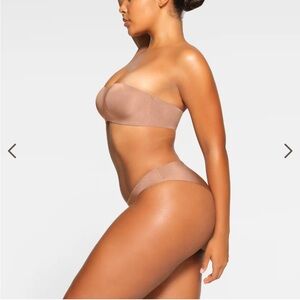 SKIMS Wireless Form Strapless Bra in classic shade Sienna color.